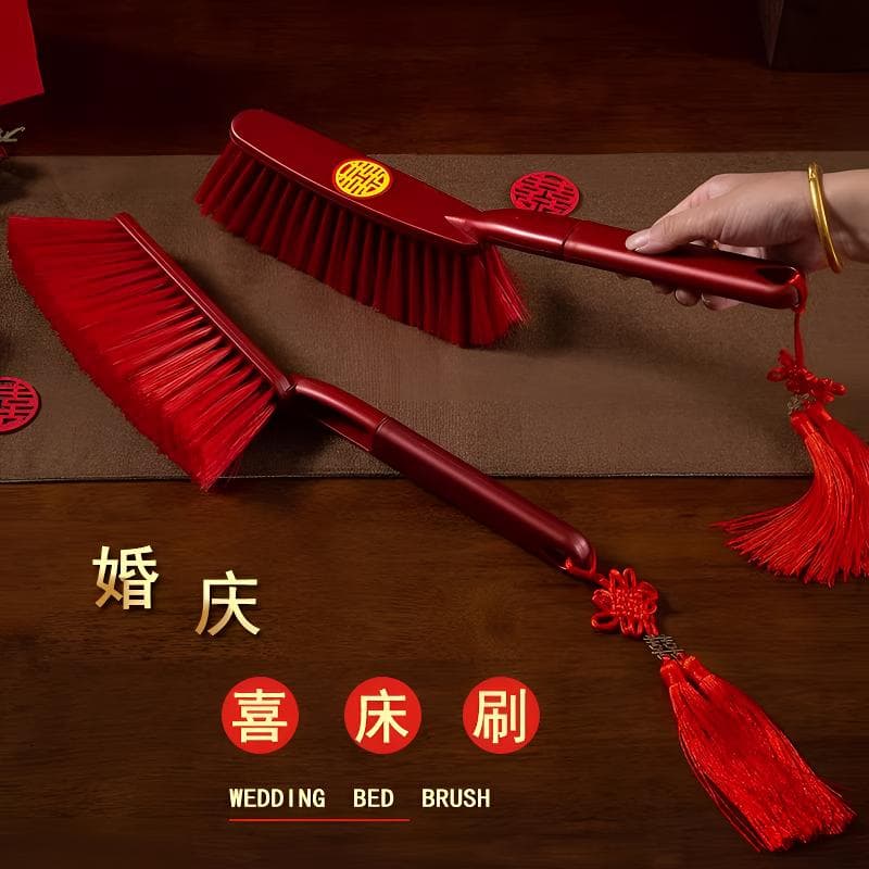 Red plastic long-handled bed brush for weddings, bridal dowry broom