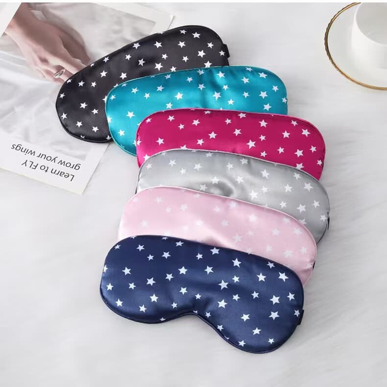 Simulated silk sleep eye mask with blackout star print, adjustable, for naps, travel and home use